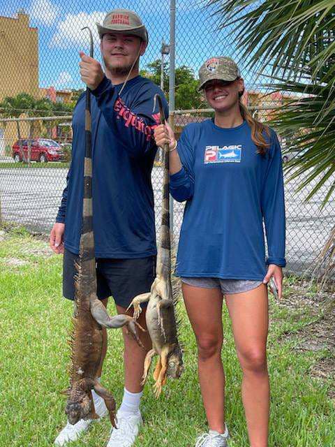 couple enjoying iguana hunting