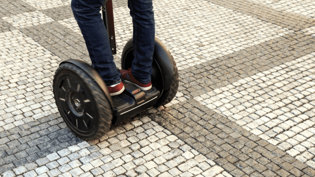 person standing outdoors on segway