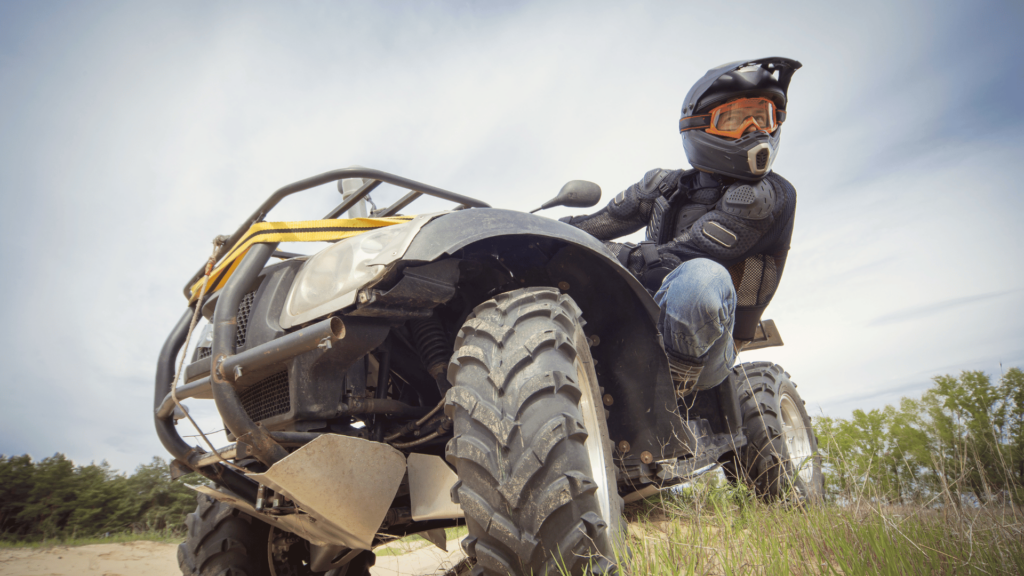 instructor teaching a side lean while Driving an ATV Safely