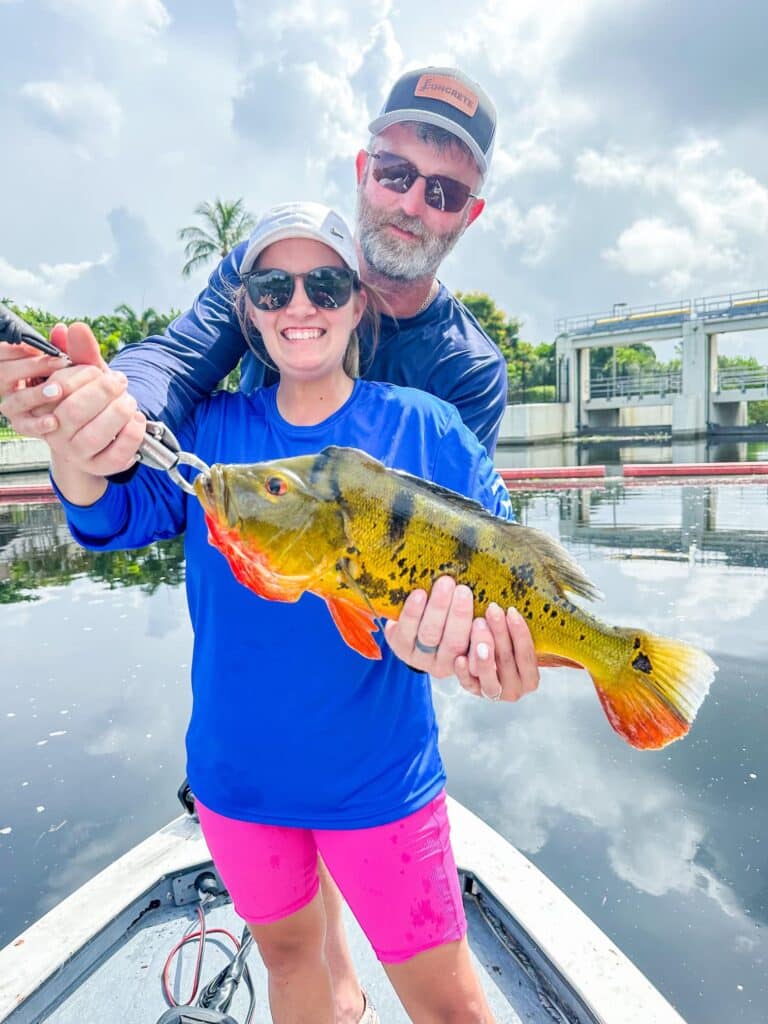 happy family that caught peacock bass